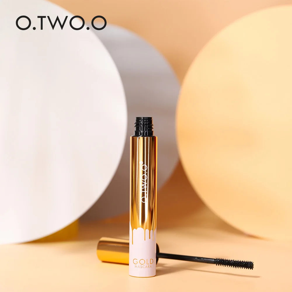 O.TWO.O 3D Mascara in gold packaging with a pink drip design and the brush next to it