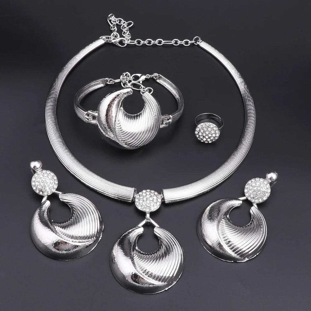 Silver plated Dubai jewelry set featuring a necklace, earrings, bracelet, and ring with intricate designs.