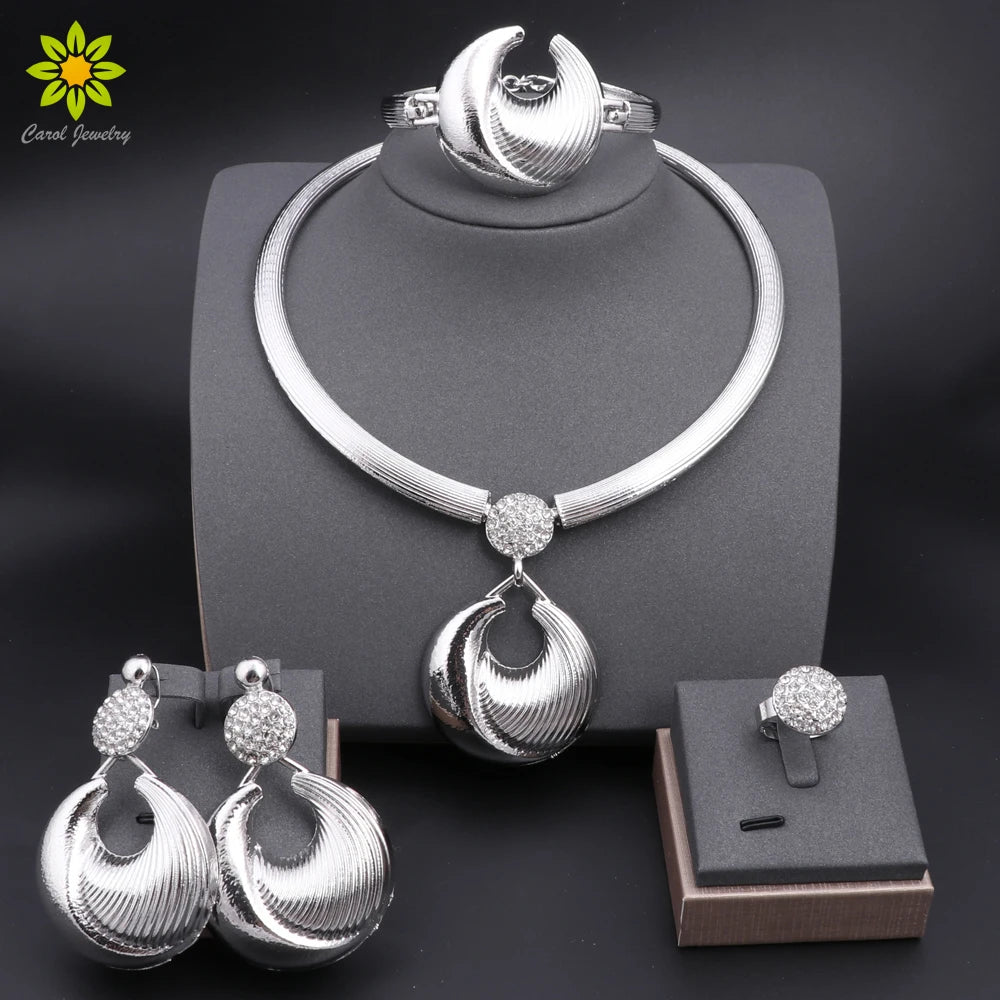 Silver plated Dubai jewelry set featuring a necklace, earrings, bracelet, and ring with intricate designs.