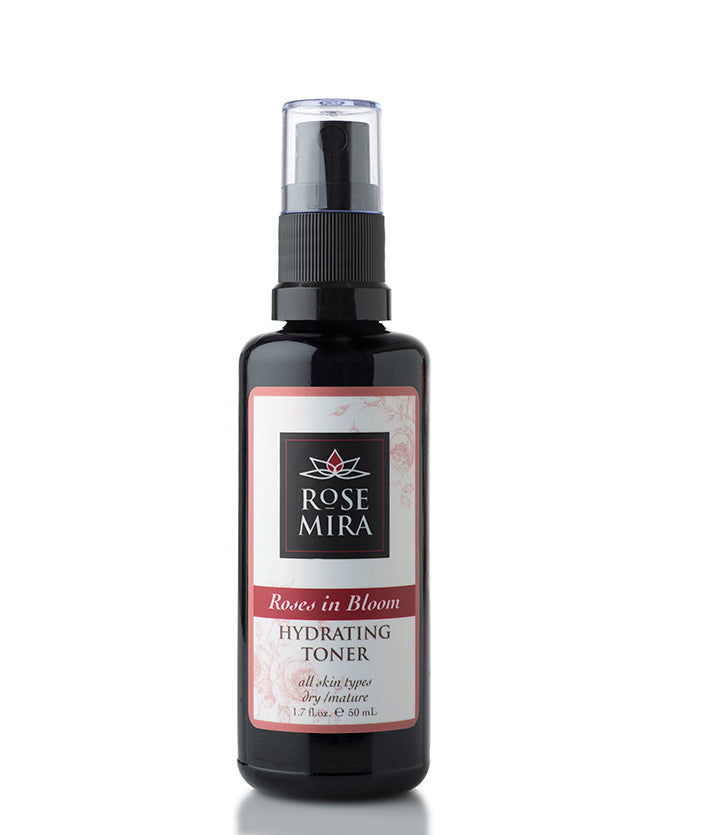 Roses in Bloom Hydrating Toner in a black spray bottle with a pink and white label
